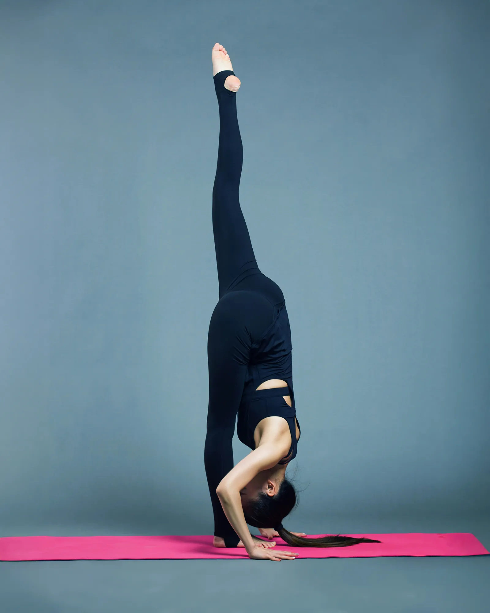 Dancer in a deep stretch during a mobility session.