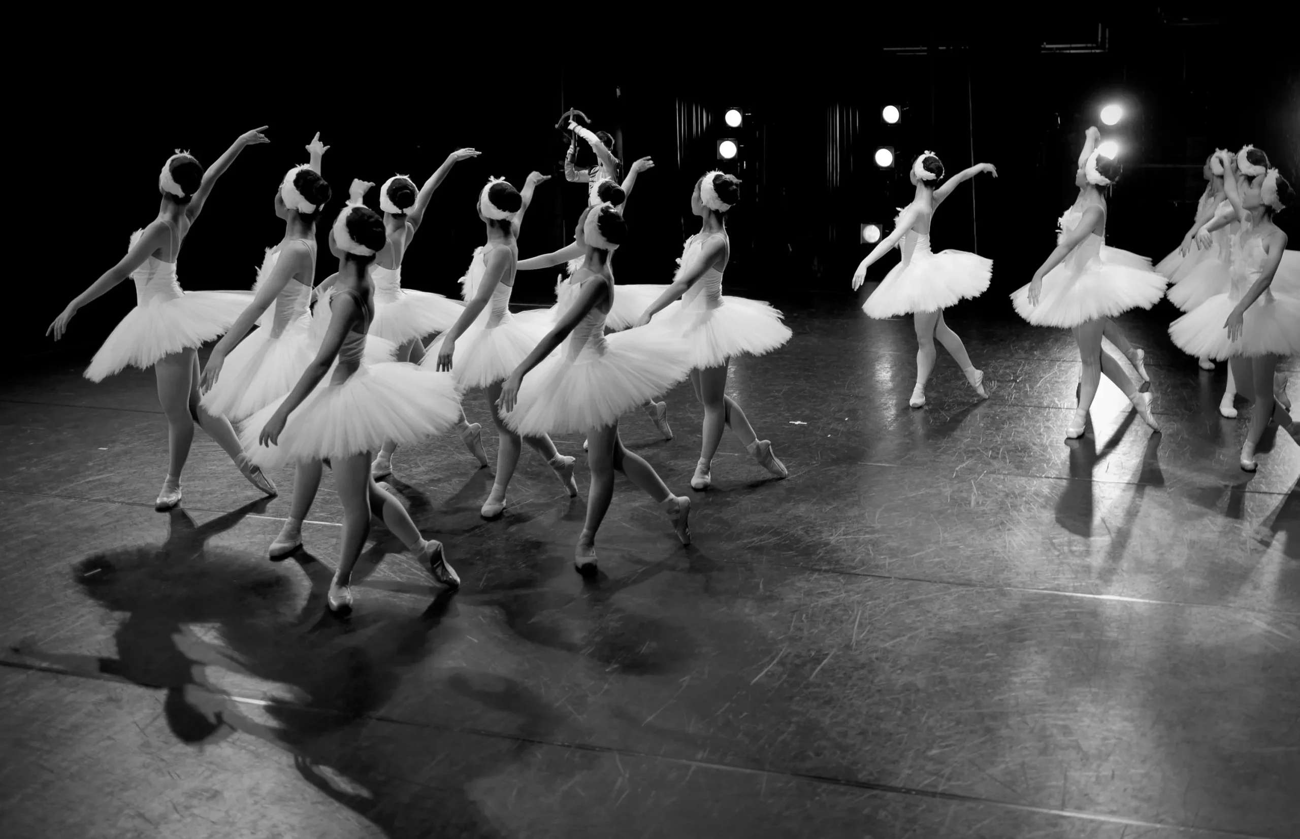 Warm, light-filled ballet studio interior.