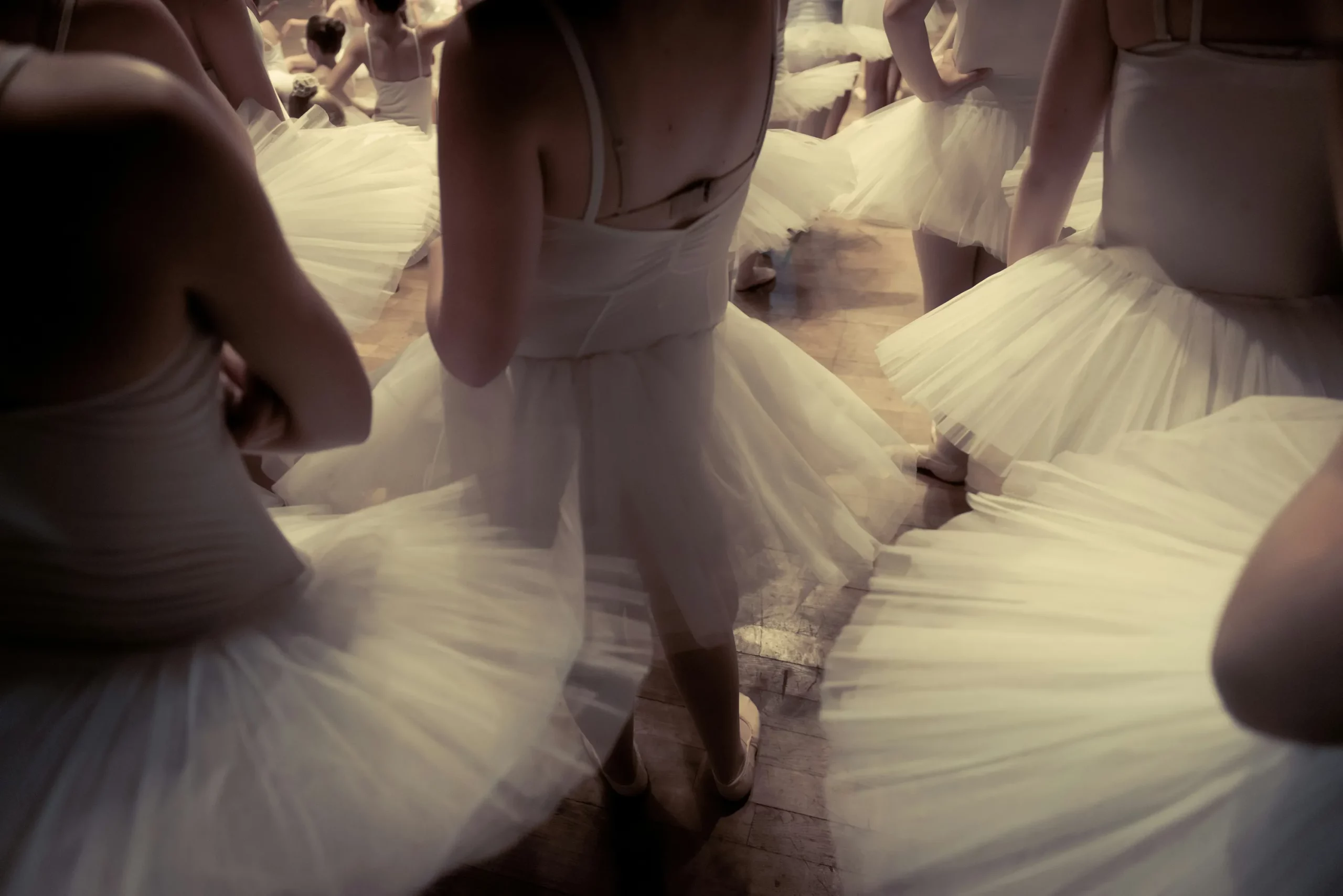 Dancers captured in warm, atmospheric light.